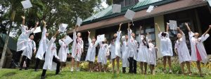 Cropped The Graduates Throwing Their Graduation Caps 1 Jpg