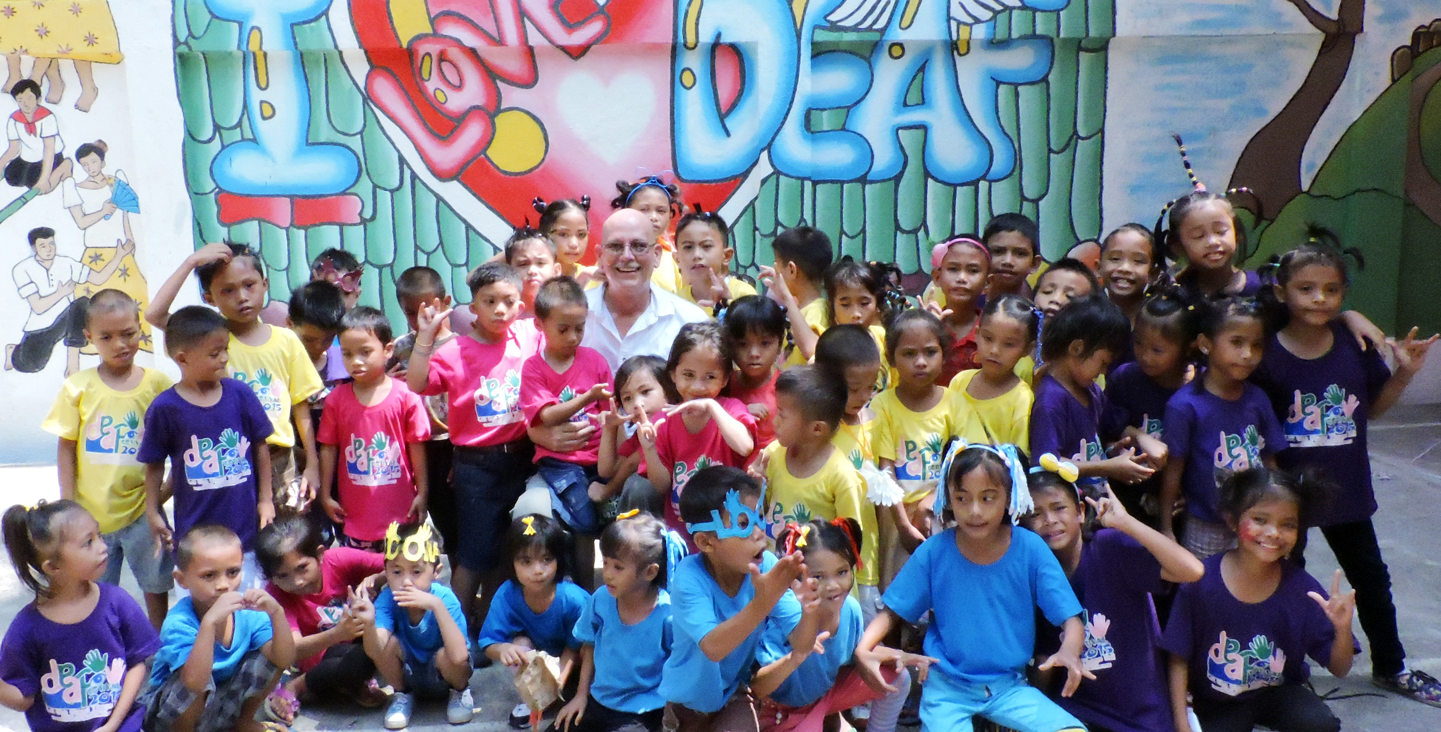 Dennis With Deaf Kids