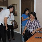 DEPED Representative Trying One Of The Services Offered By The Bohol Hearing Clinic
